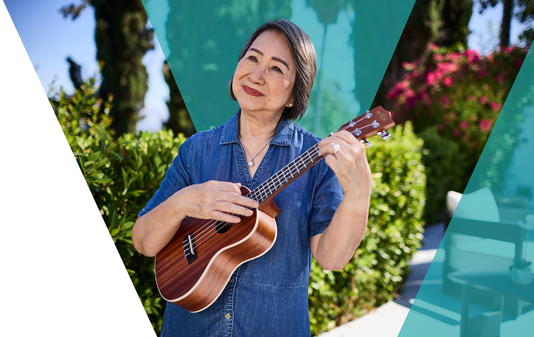 Video: Woman playing a ukulele.